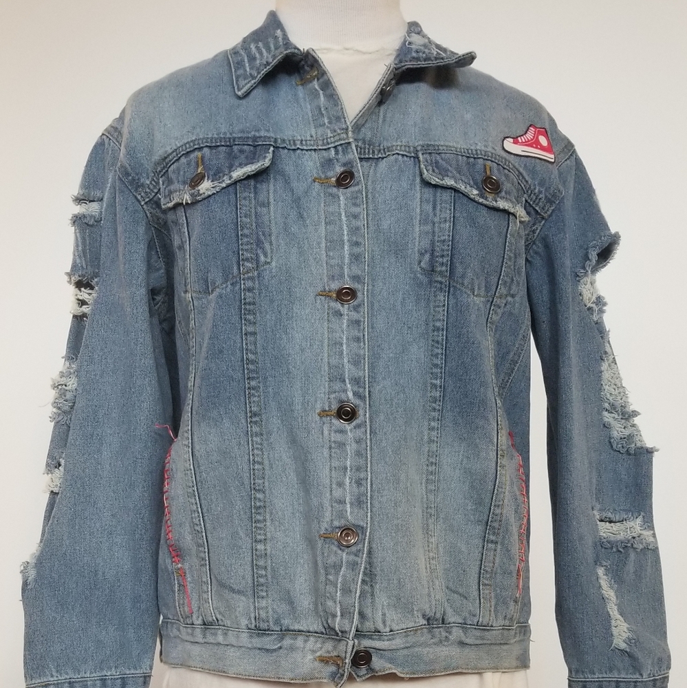 Distressed denim jacket with red converse patch